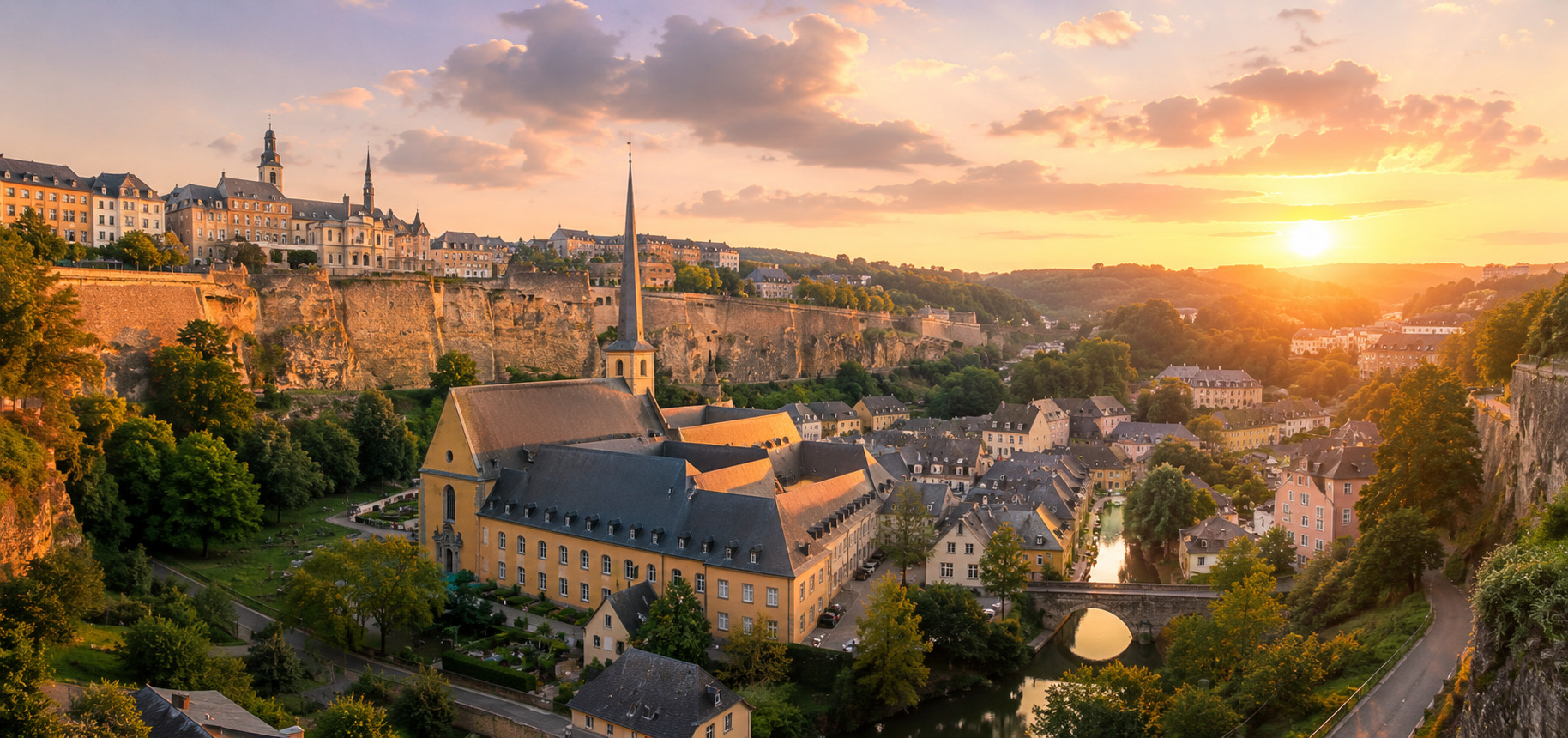 Panoramic view of Luxembourg Grund district at golden hour